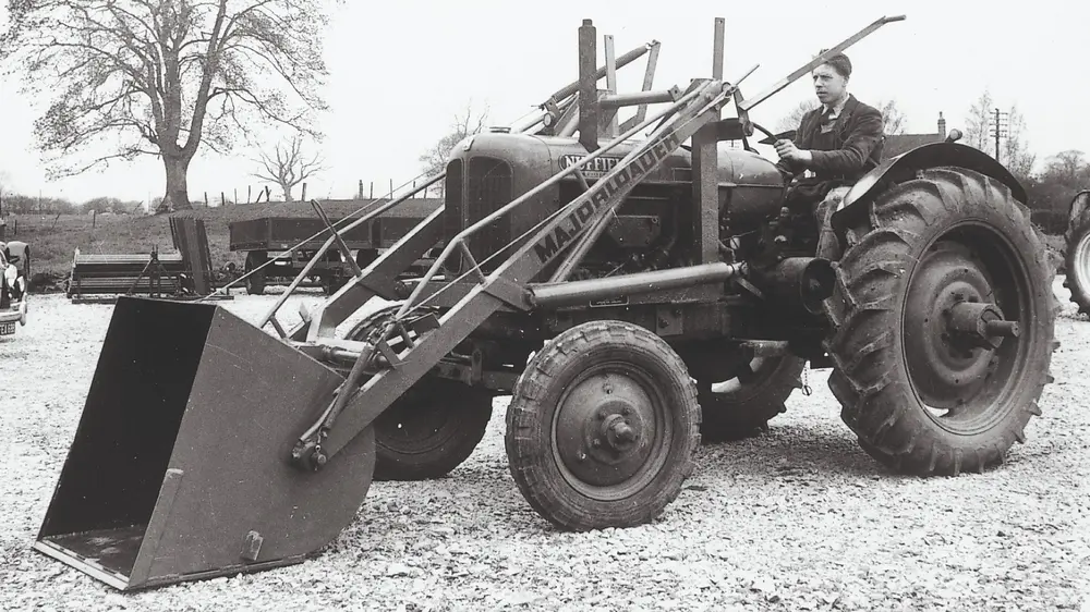 1948 - JCB employee the late John Wheeldon on an early product, the Major Loader