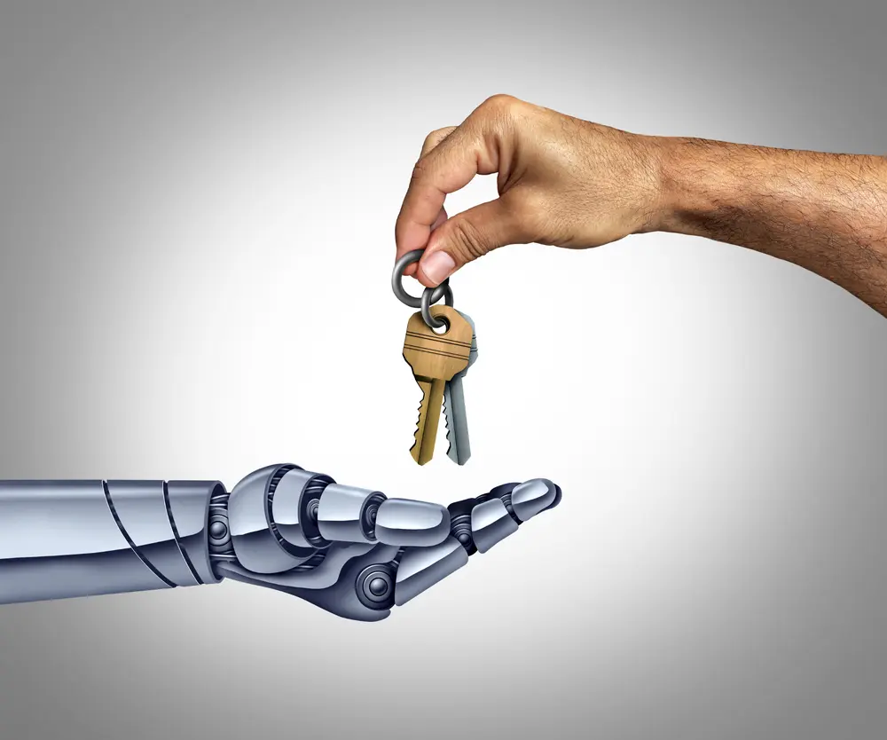 Main humaine qui donne des clés à un robot